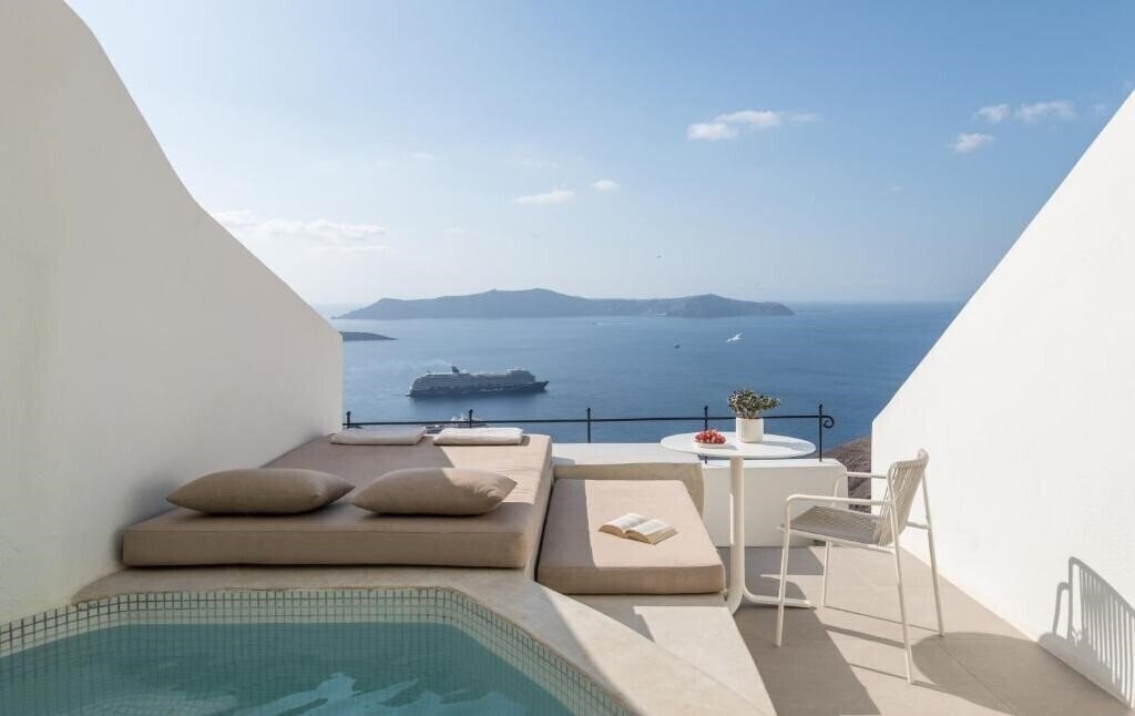 Фотография Enigma Apartments And Suites 4*