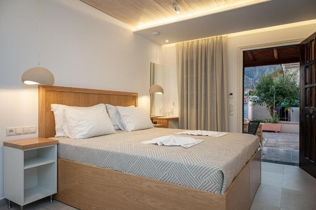 Fotografii Athena Beach (Kokkari) отель без категории