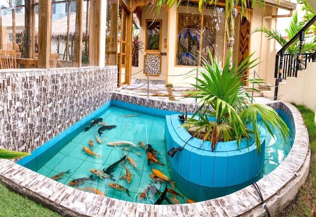 Imaginea Manta Dhangethi Guest House коттедж