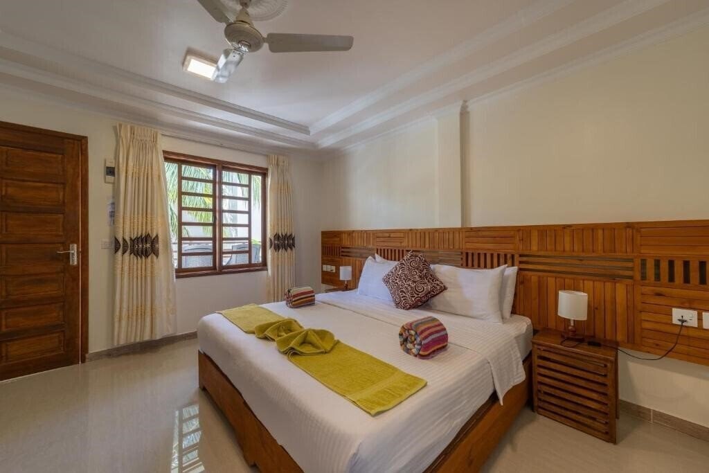 Fotografii Kamadhoo Inn Guest House гостиный двор