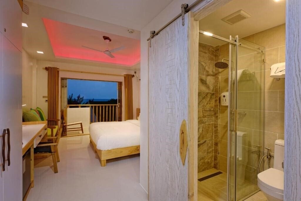 Fotografie Luau Beach Inn Maldives Guest House гостиный двор