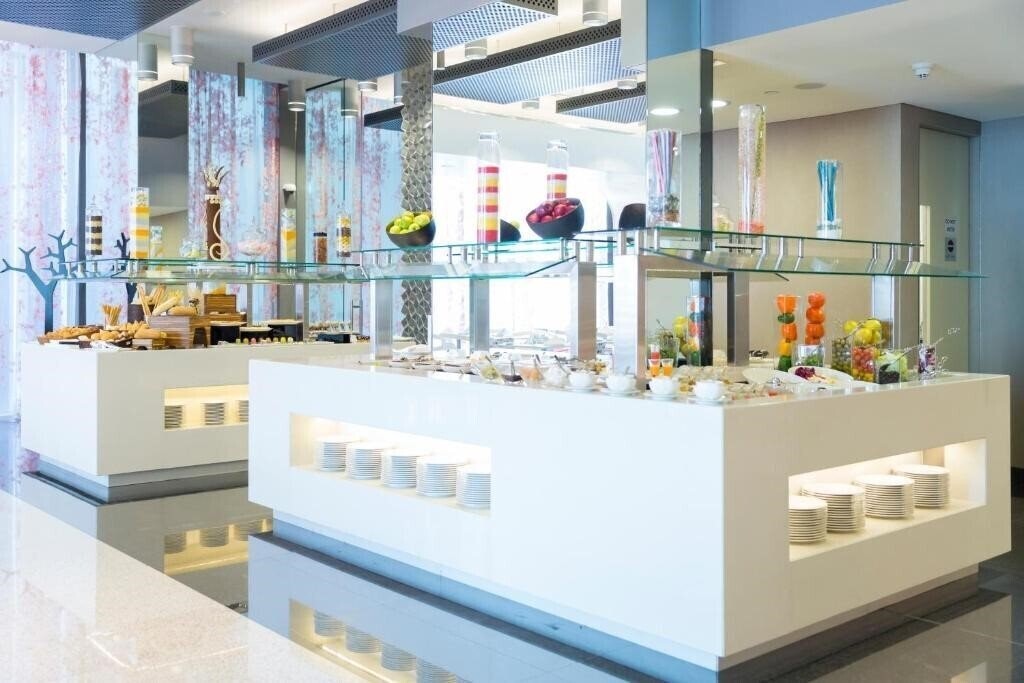 Imaginea Adagio Abu Dhabi Al Bustan апартаменты