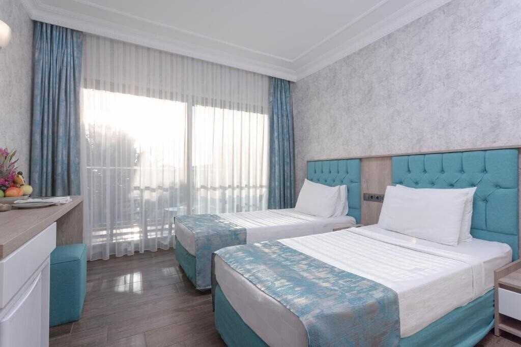 Фотография Anadolu Hotels Didim Club (ex. Palm Wings Beach Resort) 5*